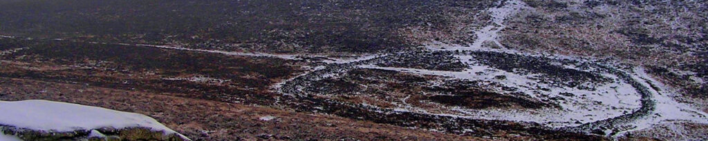 Frosty photo of the Bronze Age  settlement  called  Grimspound on Dartmoor. Competition winning image.
