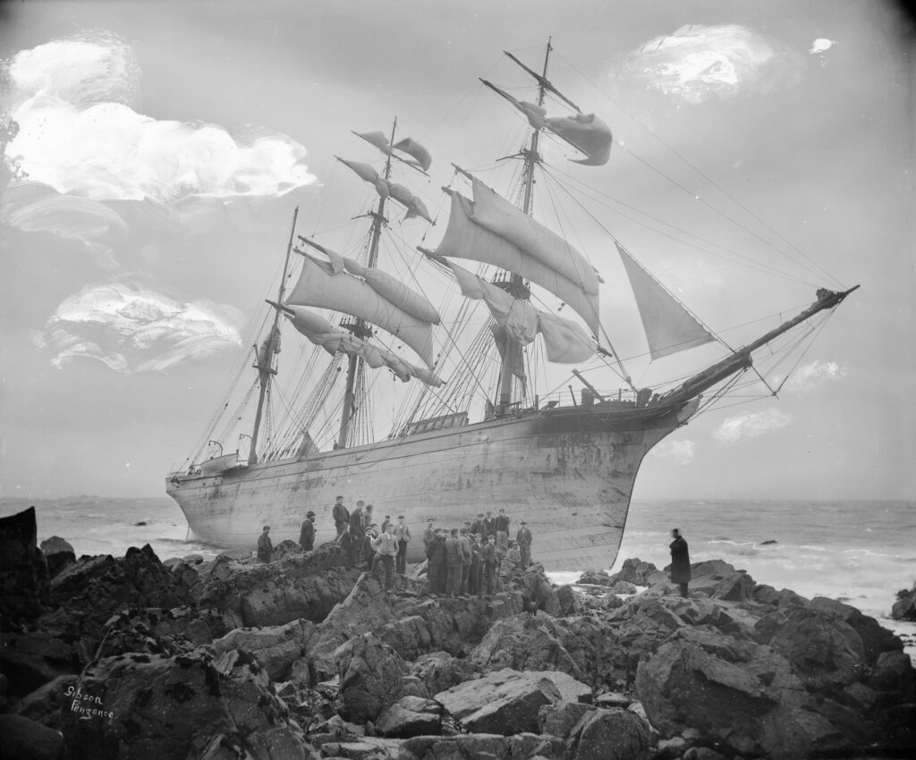 Photo of Starboard side of G14146; Glenbervie, just aft of bow from the beach. People standing on the rocks by the hull